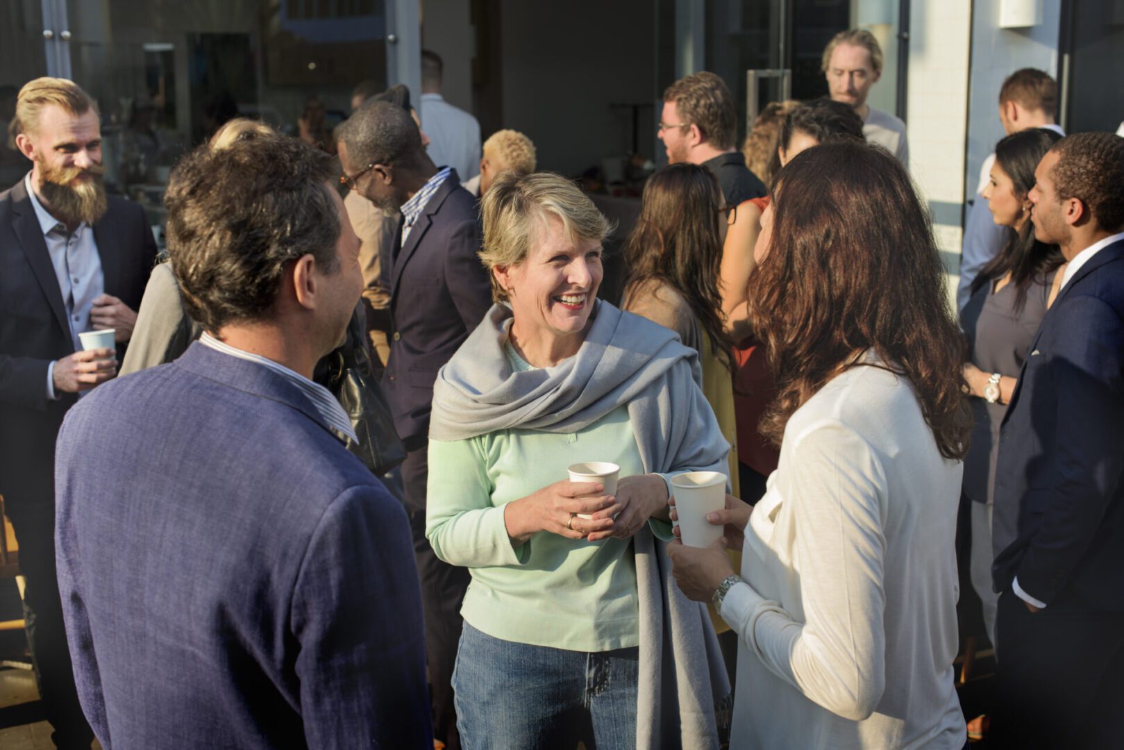 People socializing at an outdoor gathering event.